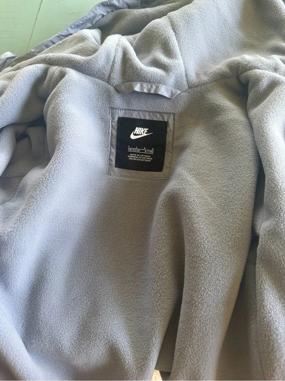 Nike Kids Light Gray Hooded Raincoat with Black Logo